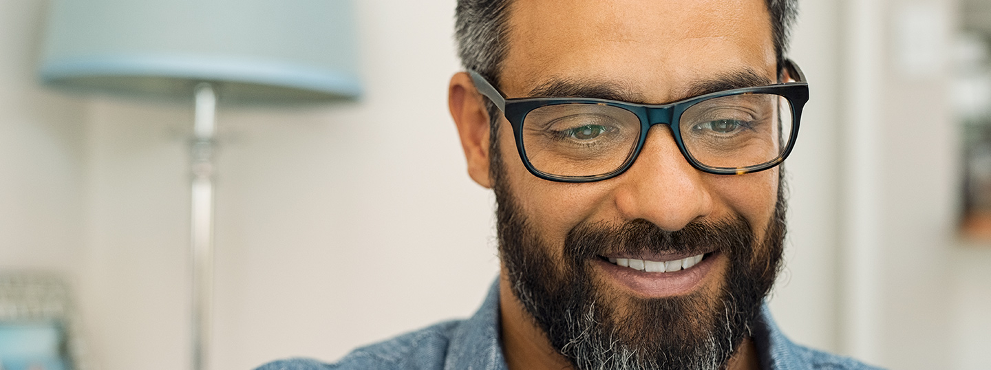 Close up of middle aged man looking at computer screen