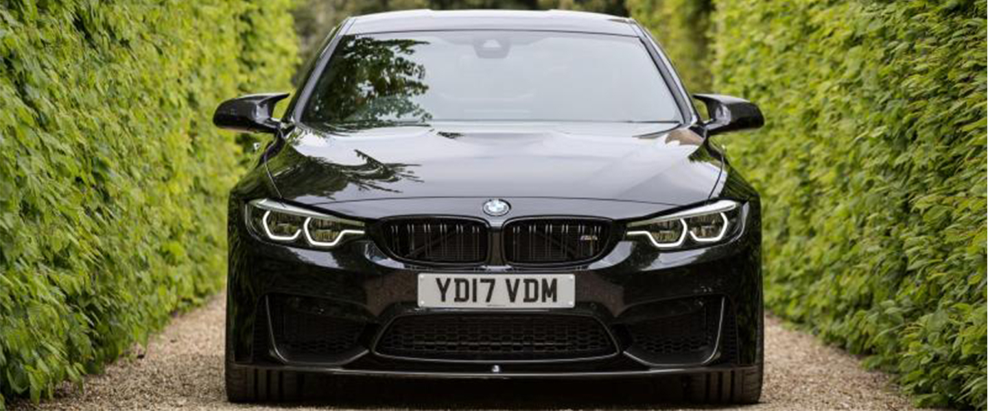 BMW car driving down an alley