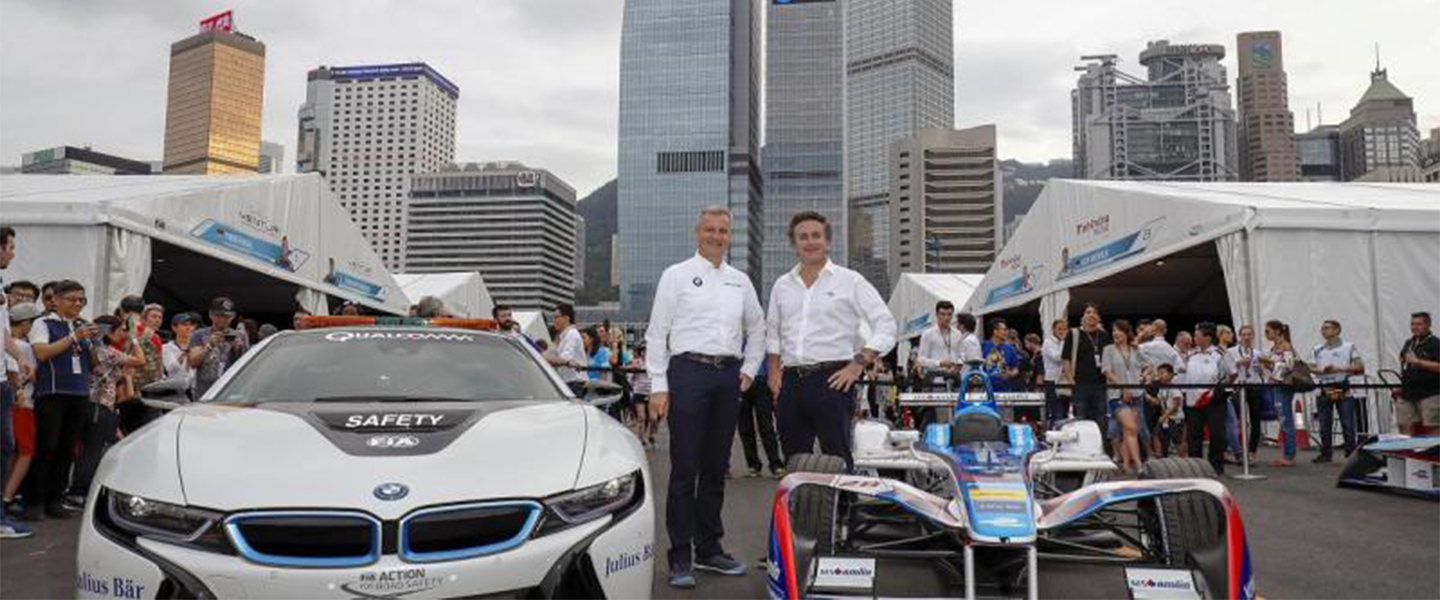 BMW car with people standing beside it